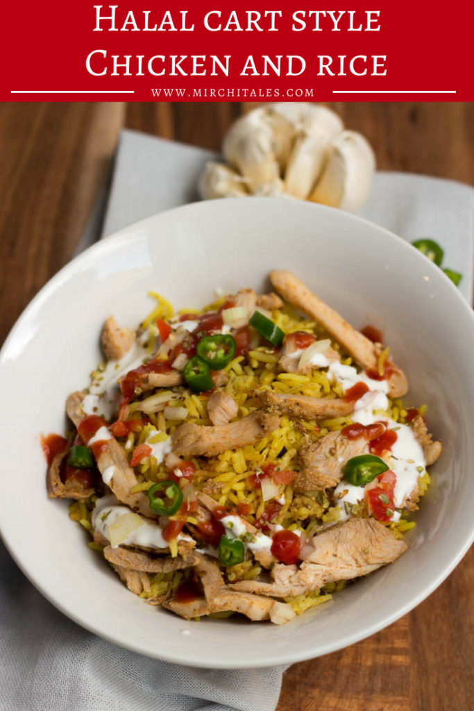Halal cart style chicken and rice is an iconic New York street food comprising of shawarma style sliced chicken piled on top of spiced yellow rice served with salad and pita bread. This is then drizzled with a tangy white sauce and a spicy hot sauce. 