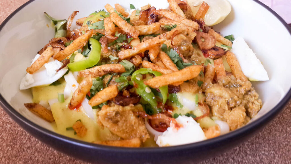 Originally from Burma, Chicken Khow Suey or Khao Suey is a popular dish among the Memon & Gujrati community of Pakistan. It comprises of noodles in a coconut or yoghurt based curry, with spicy chicken or beef and an array of condiments.