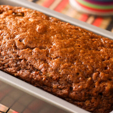 This delicious banana bread with a hint of cinnamon is a hybrid between a sweet cake and a hearty bread loaf. Make sure you use ripe banana's for the best flavor.