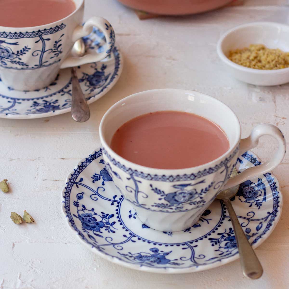 A tea cup filled with Kashmiri Pink Chai.