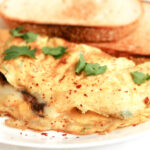 Make this stuffed mushroom and cheese omelette for breakfast and serve with tea and toasted bread. Or perhaps dinner with a light green salad on the side.