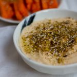 With a sprinkling of Egyptian dukkah on top, this smooth and creamy dukkah hummus is the perfect dip to serve with raw vegetables or pita bread.