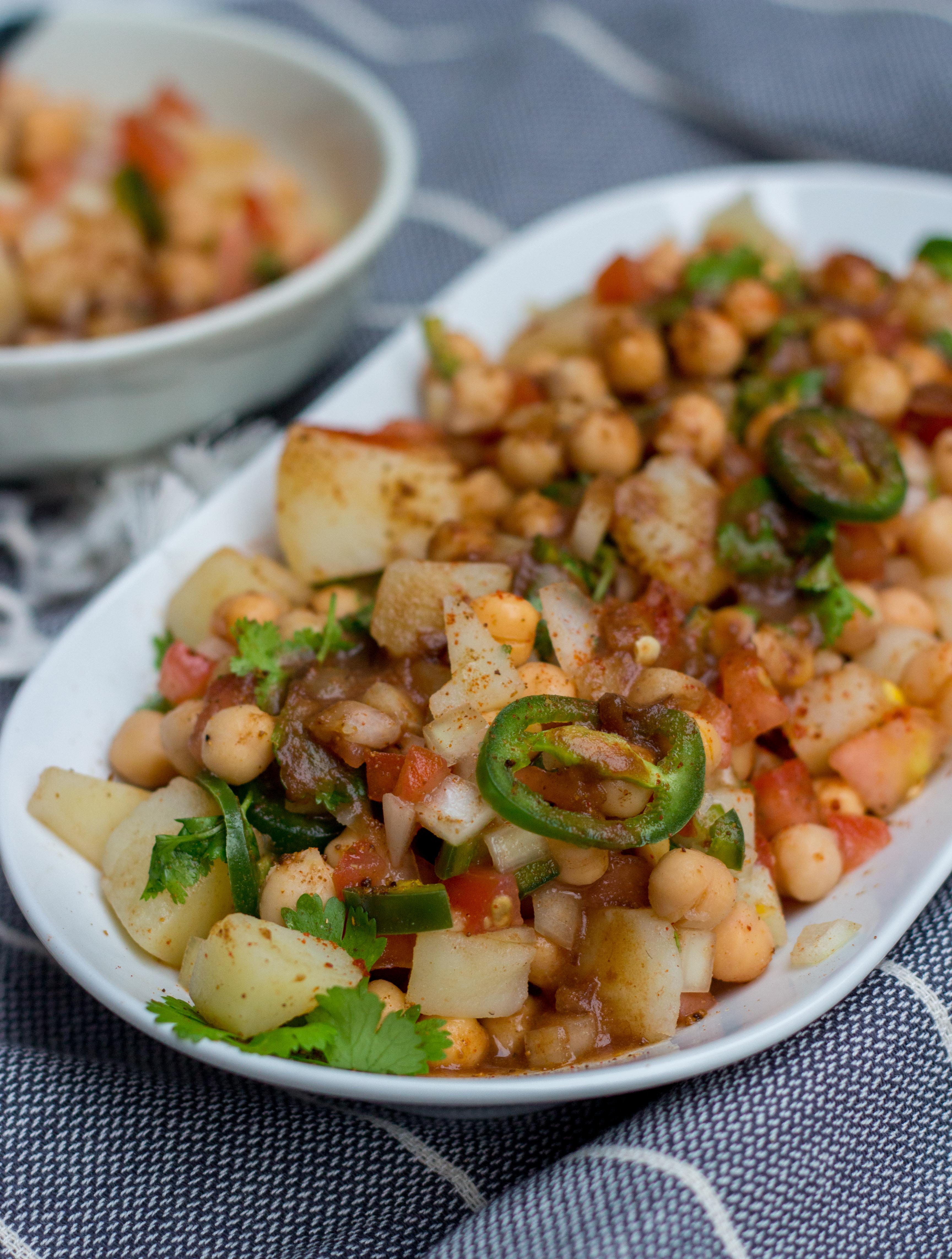 Aloo chana chaat is a Pakistani and Indian street food style snack made with potatoes and chickpeas. It’s super simple to make and is a perfect blend of spice with tanginess!