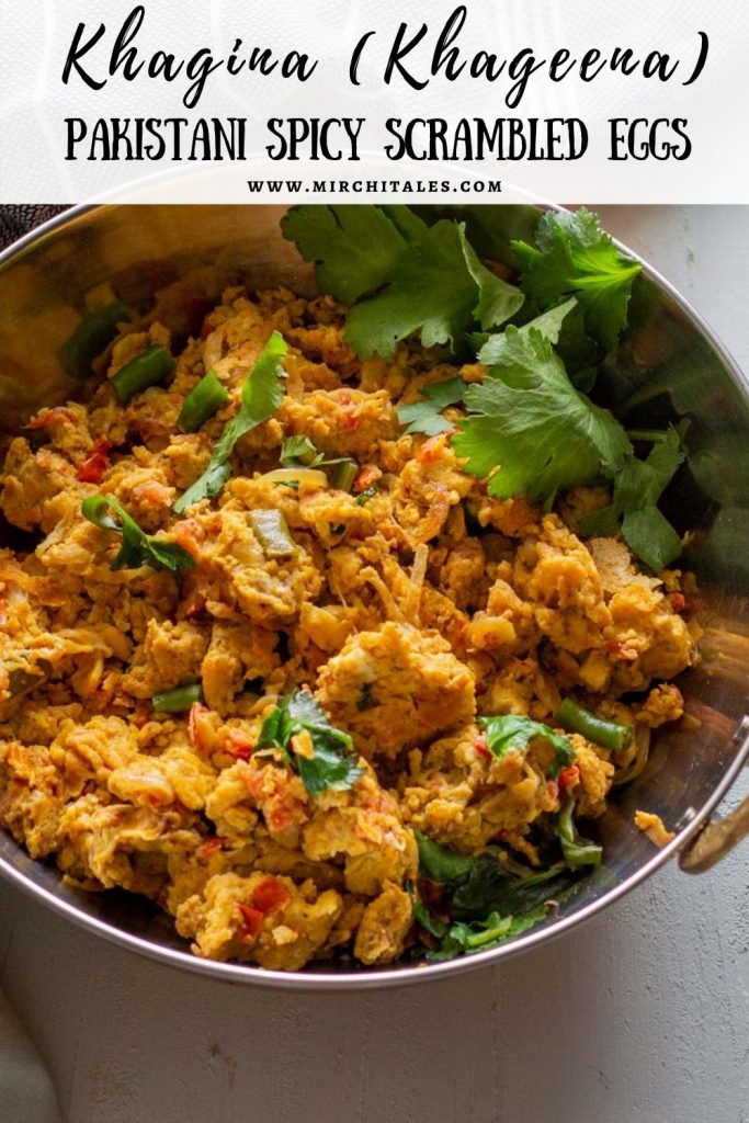 Khagina or Pakistani style scrambled eggs in a silver serving bowl with bronze handles. The khagina is topped with coriander leaves.