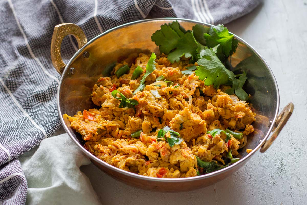 Khagina or Pakistani style scrambled eggs in a silver serving bowl.