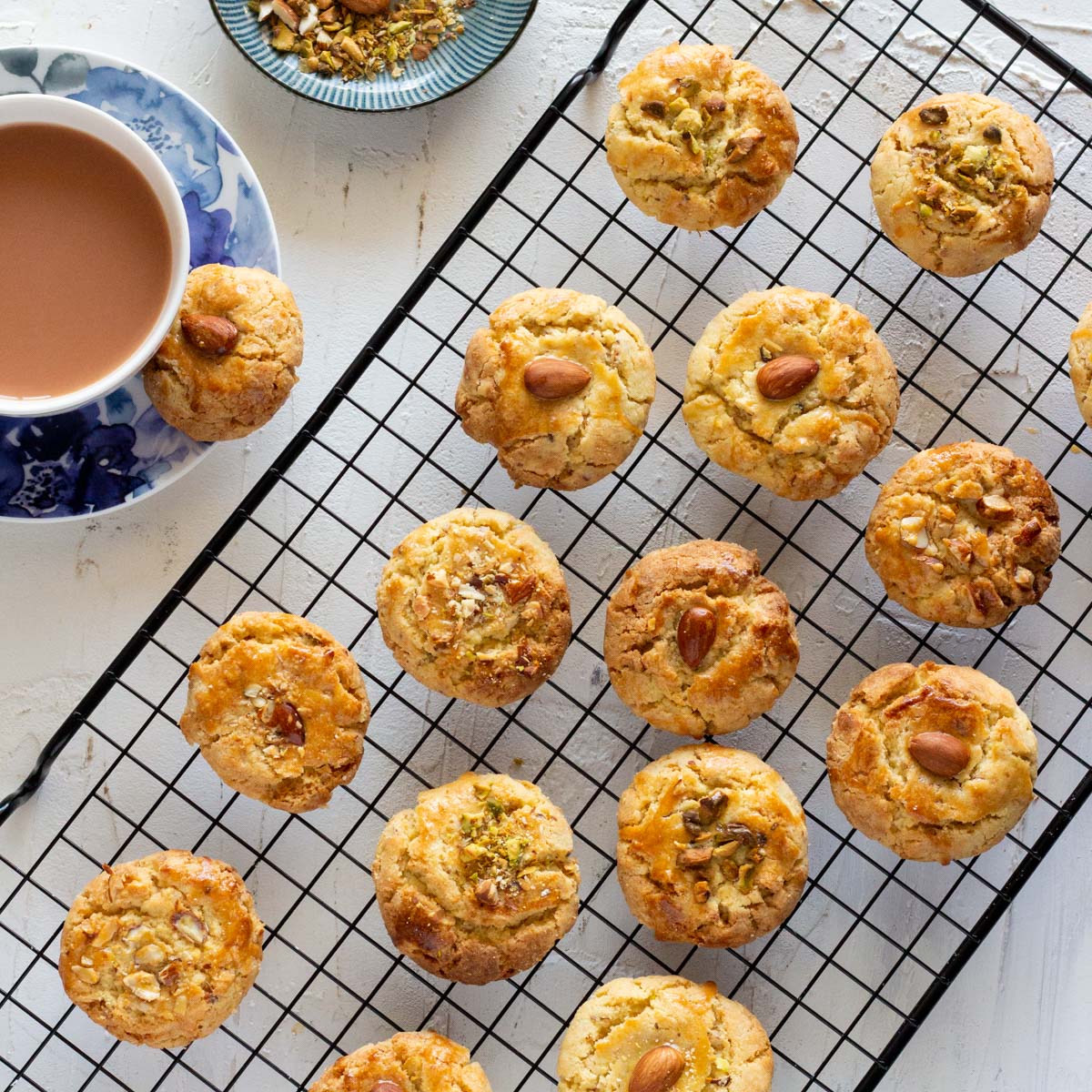 A cooling rack placed diagonally with nan khatai on top of it.