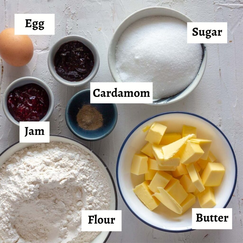 Ingredients laid out and labelled for cardamom thumbprint jam cookies.